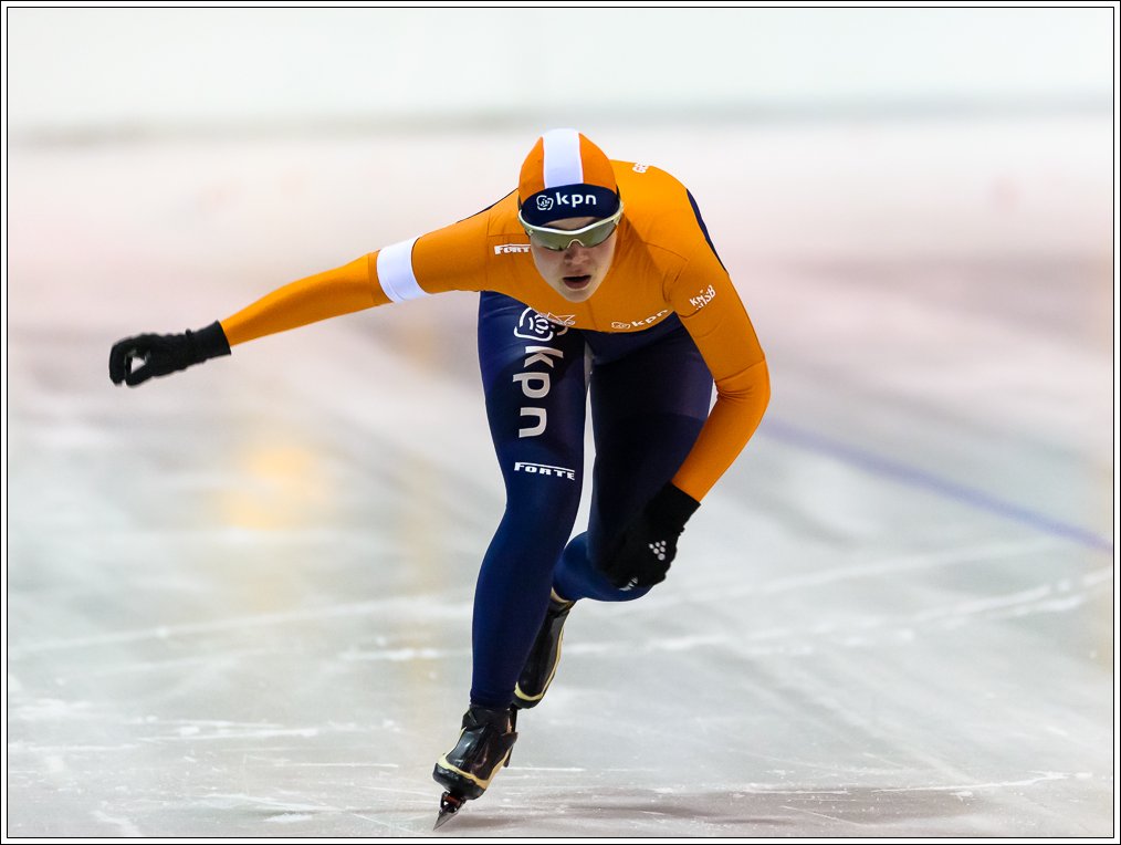 an image of a man going fast on skates