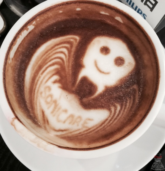 a foamy latte with a creepy face inside