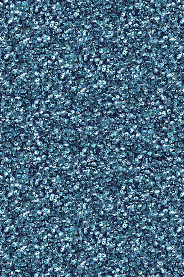 a blue, speckled surface with green and white spots