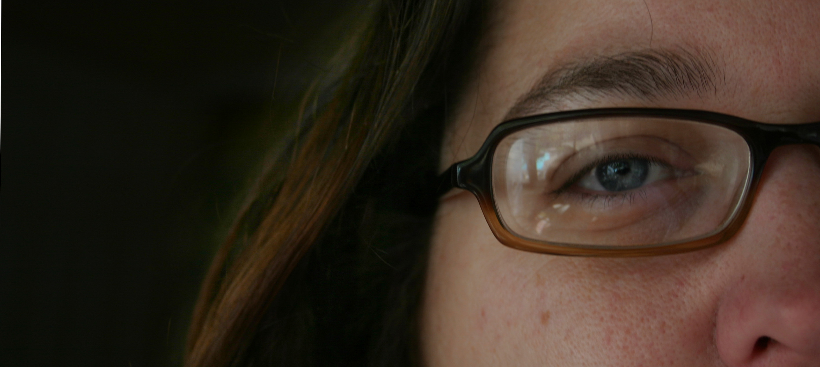 a close up of a person's eye with the camera reflecting them