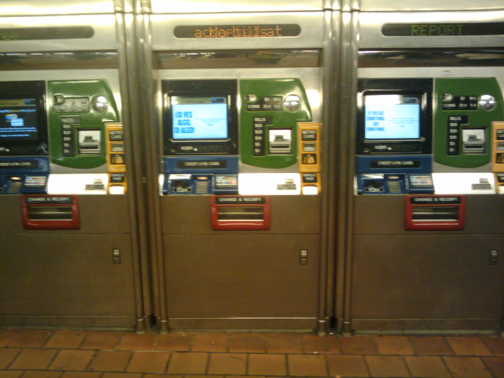 atm machines with two digital screens sit in a public bathroom