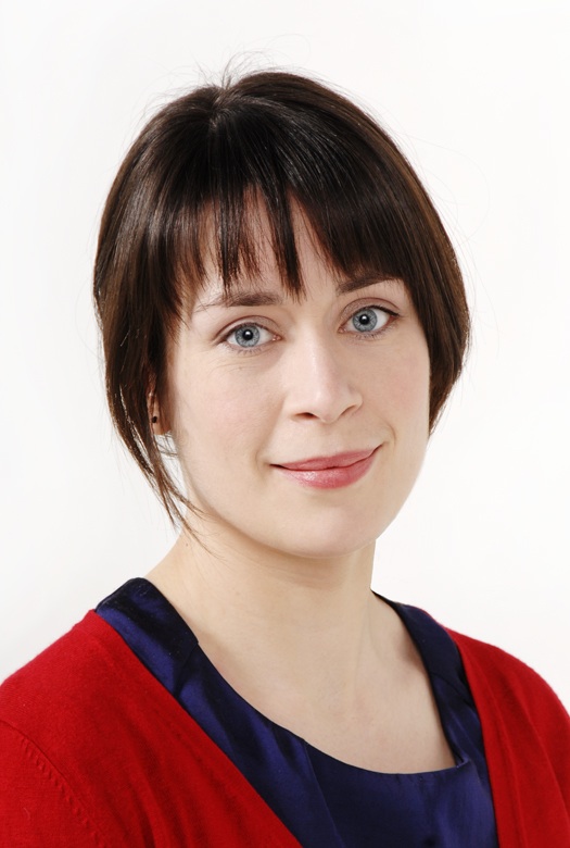 a woman is wearing a red and blue top