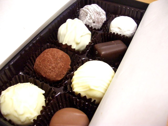 a chocolate box that has a variety of different colored candies