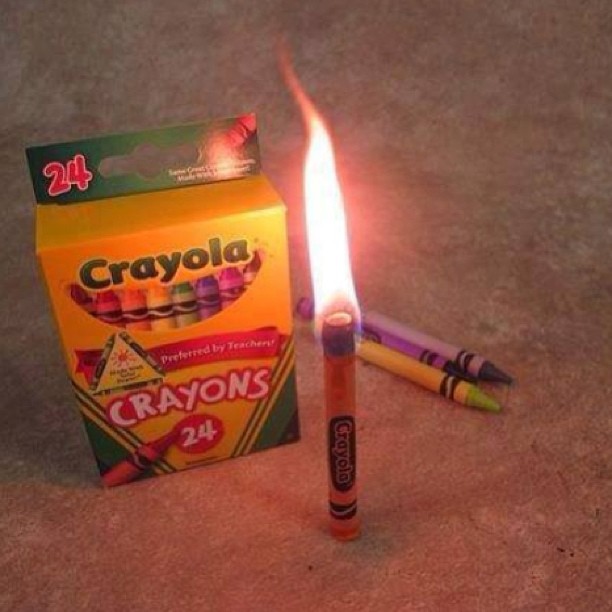 a package of crayons sitting next to an opened box