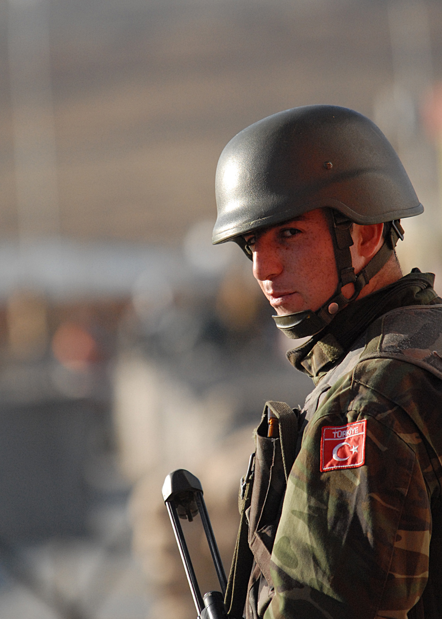 a soldier in uniform is holding his skis