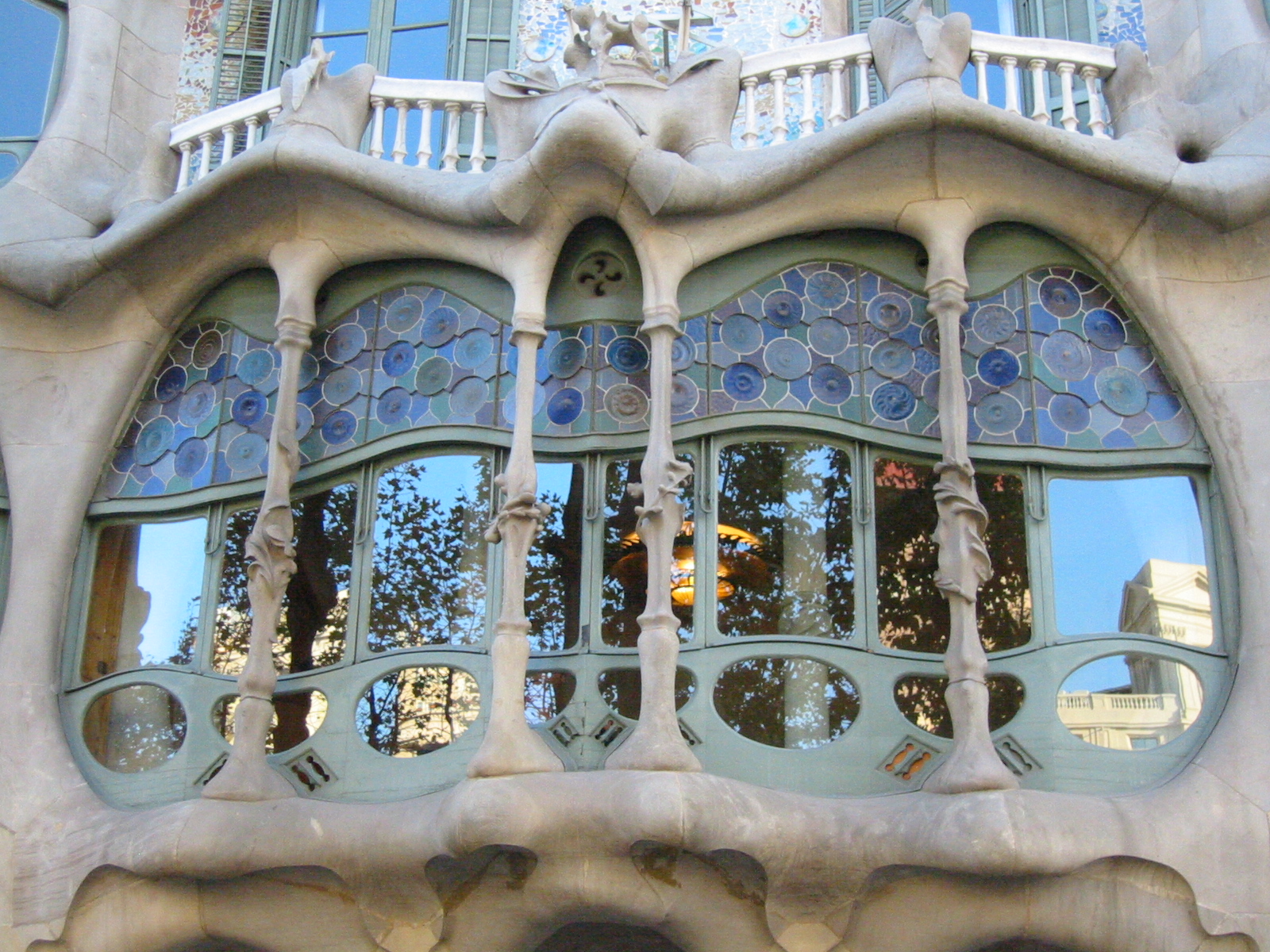 the windows have decorative designs and shapes on them