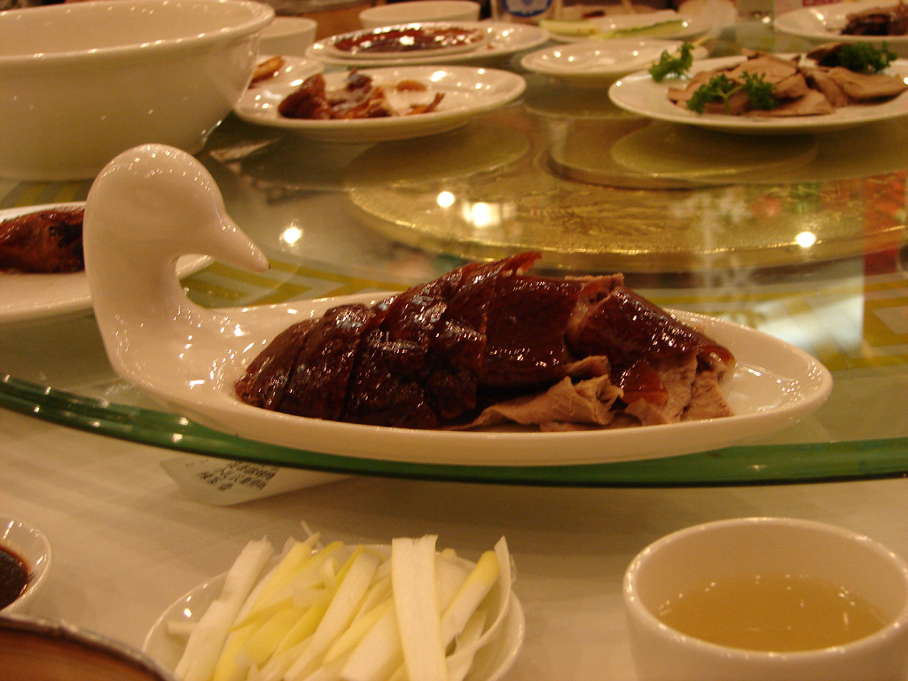 dishes of food and tea are on the table