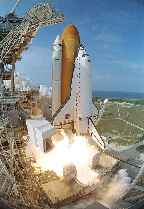 a rocket flies toward the camera and lifts off