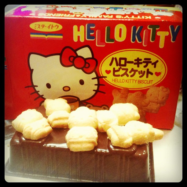 hello kitty chocolate box with chocolates and cookies on it