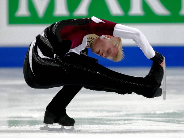 a man is skating on an ice rink