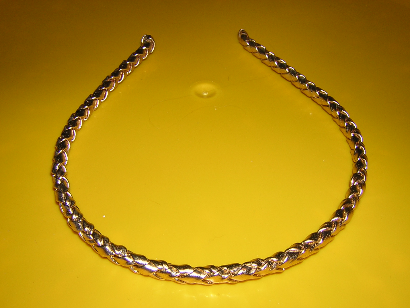 a gold chain with links and beads