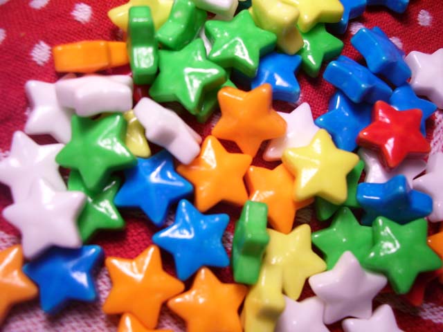 a table filled with lots of colorful star shaped candies