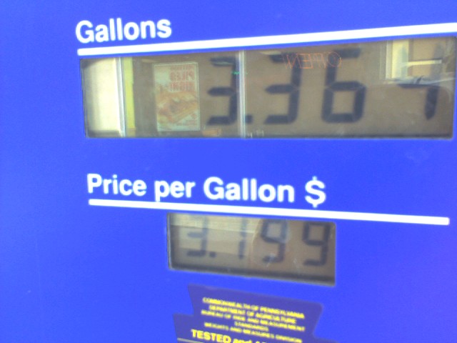 the price of gas is being displayed on a gas pump
