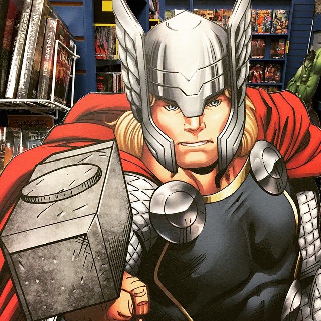 a superhero comics character in armor with hammer