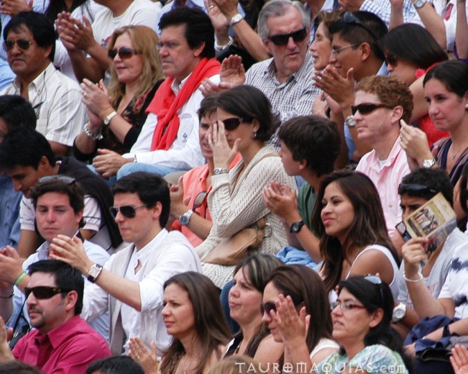an image of people in the audience doing soing