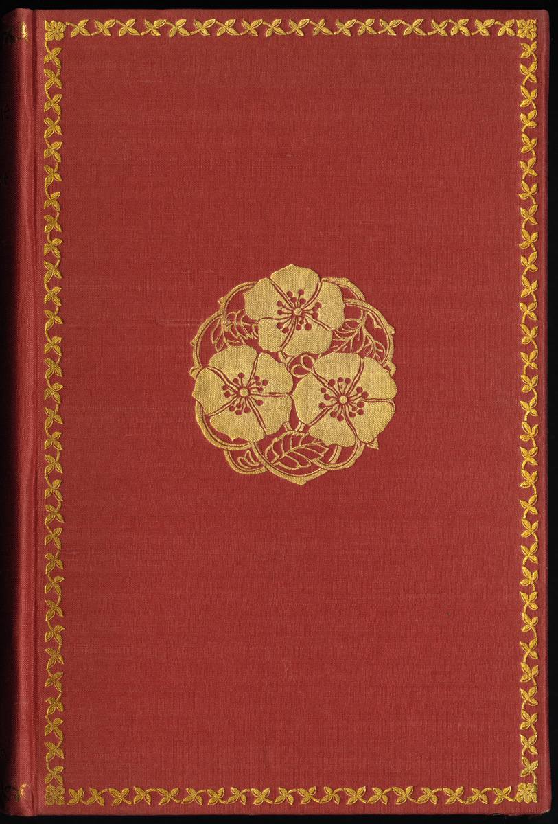 a red book with a gold doily design