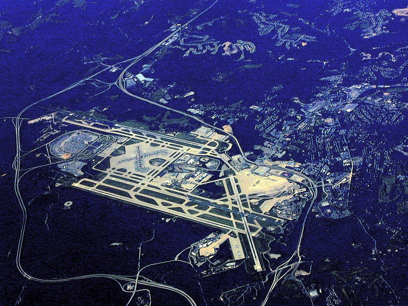 an aerial view of an airport in the air