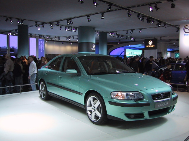 a light blue volvo s car is on display