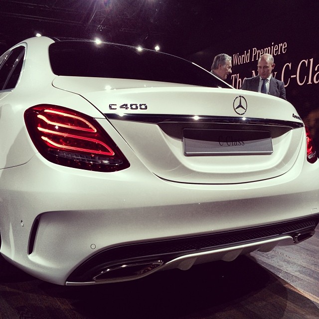 a mercedes cla parked on a stage at a show