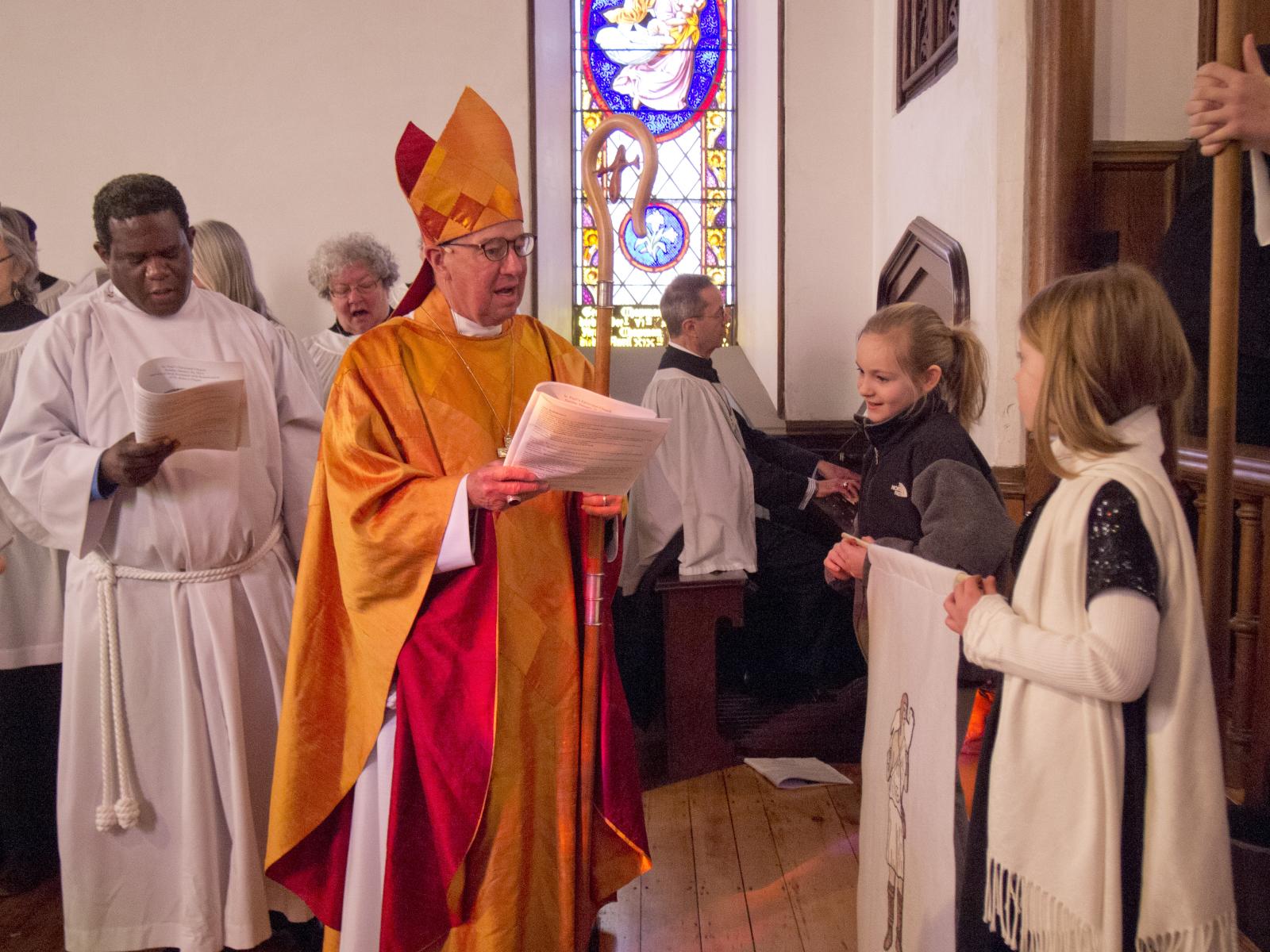 a group of people in church with choir and priest