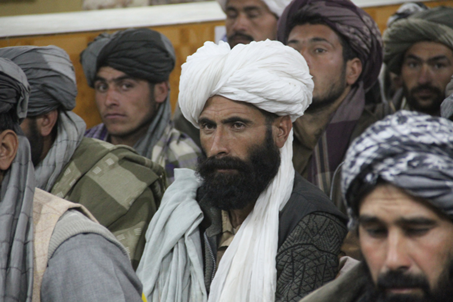 several men wearing turbans and ties around their heads