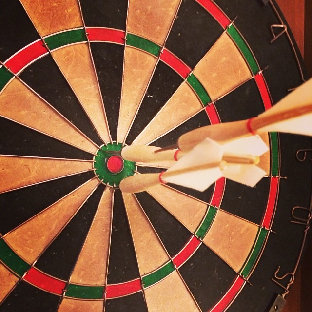 the white arrow is stuck into a dart's back