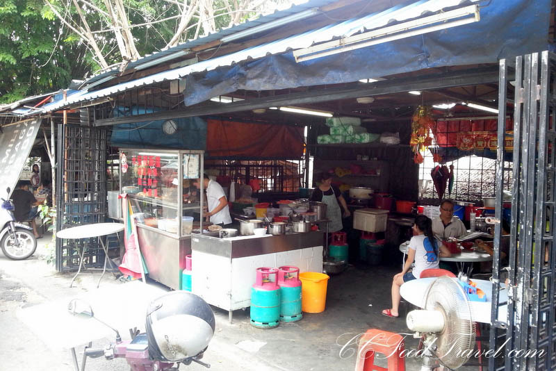 an outdoor food market on the side of the road