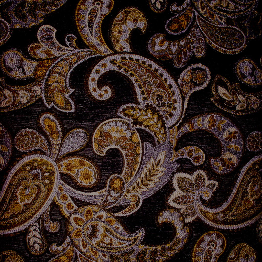 a brown and black fabric with gold paisley design