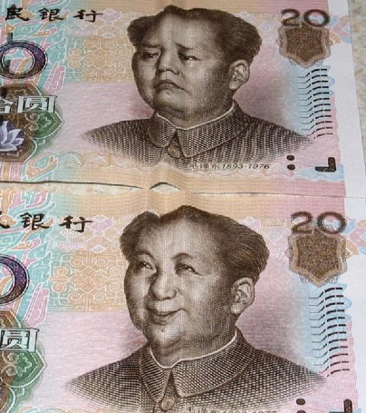 three bills with portraits of people and symbols