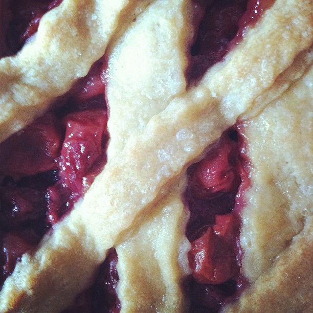 fresh fruit pies sitting in a pan, the crust on top