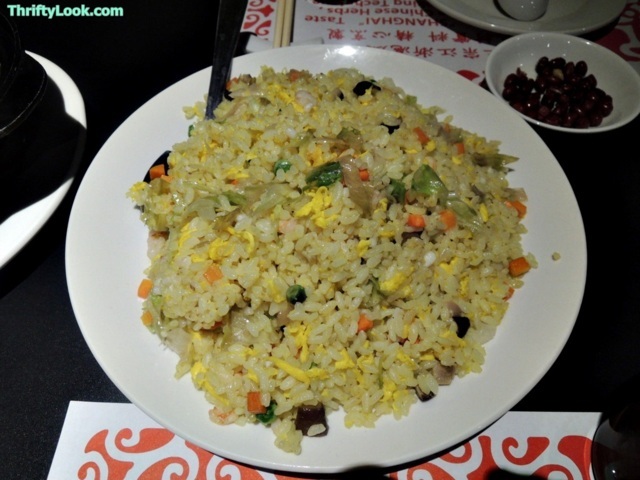 the rice with a side of fish is mixed in with other asian ingredients