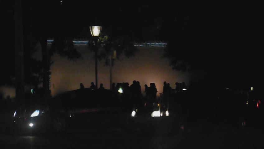 silhouettes and people on the road at night