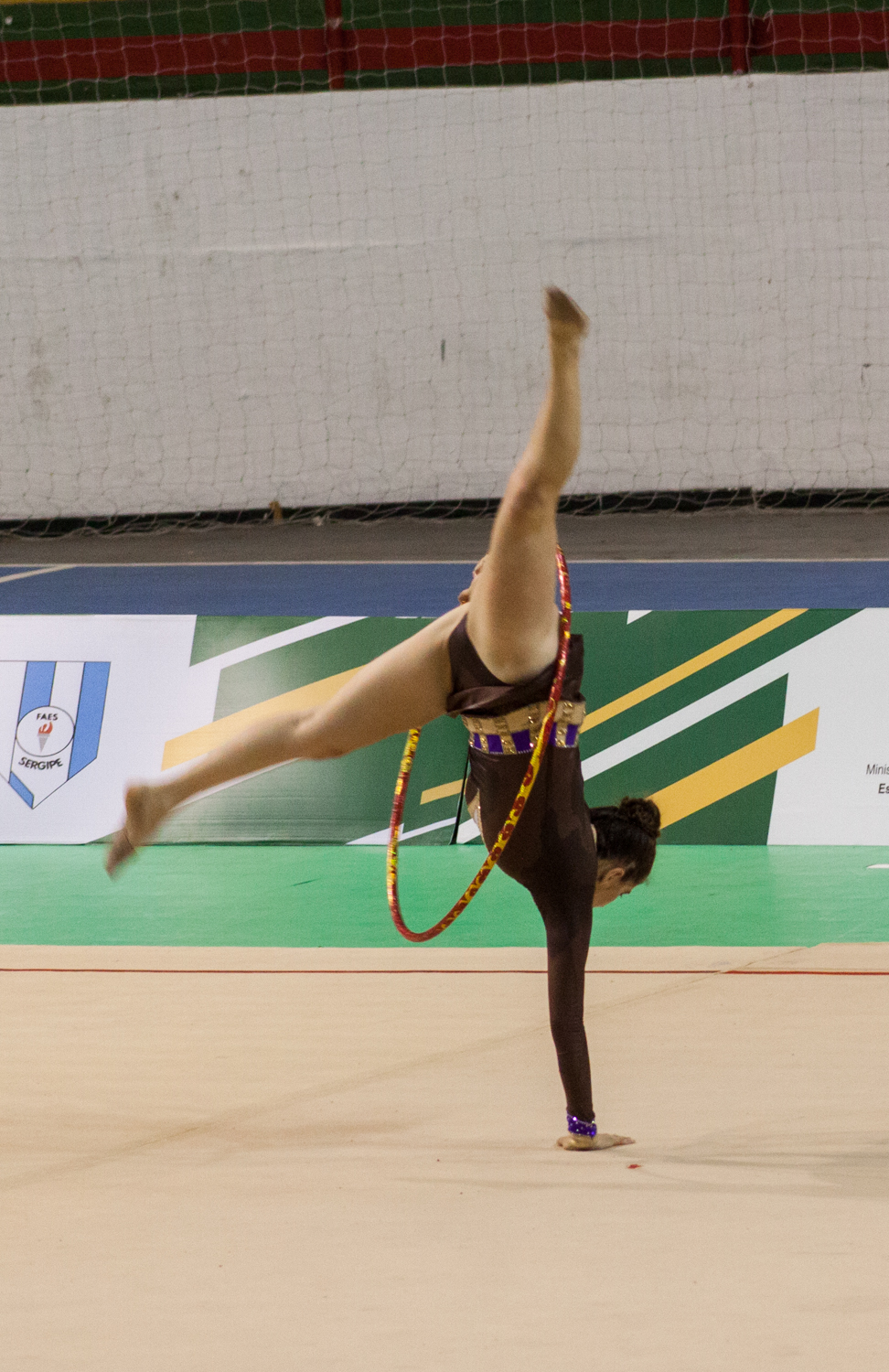 a person on a pole performing aerial tricks