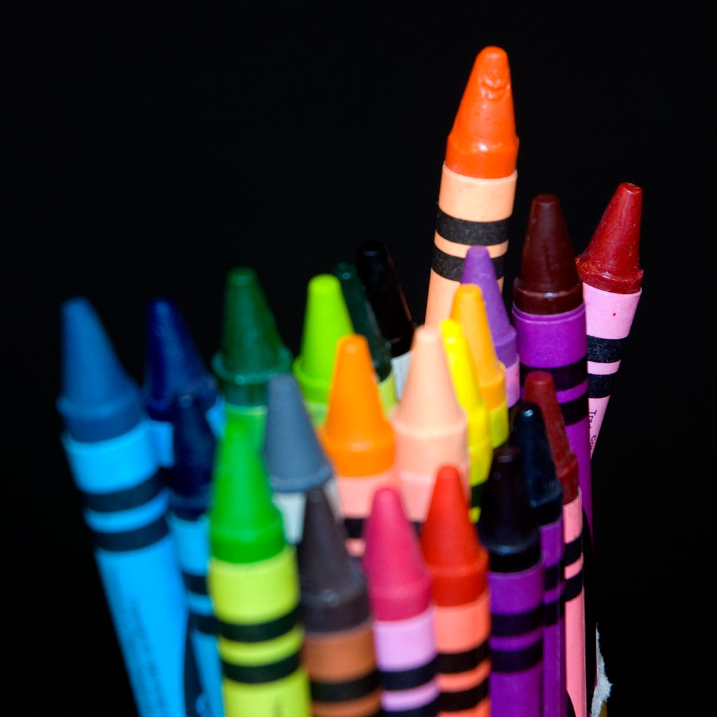 the assortment of crayons in the pile are shown