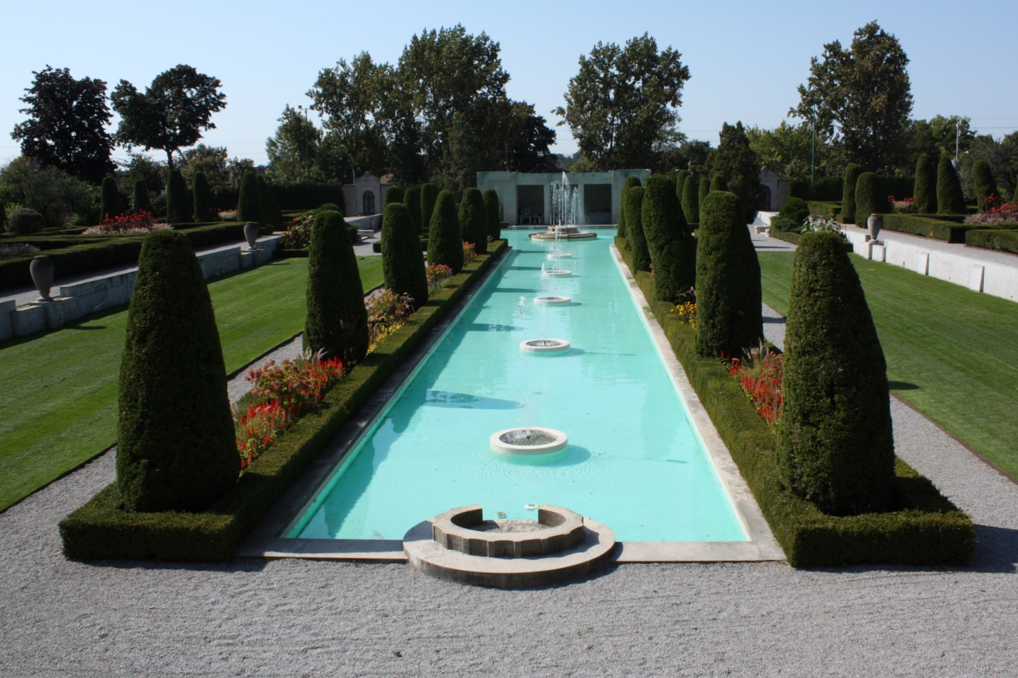 the garden is full of greenery and water