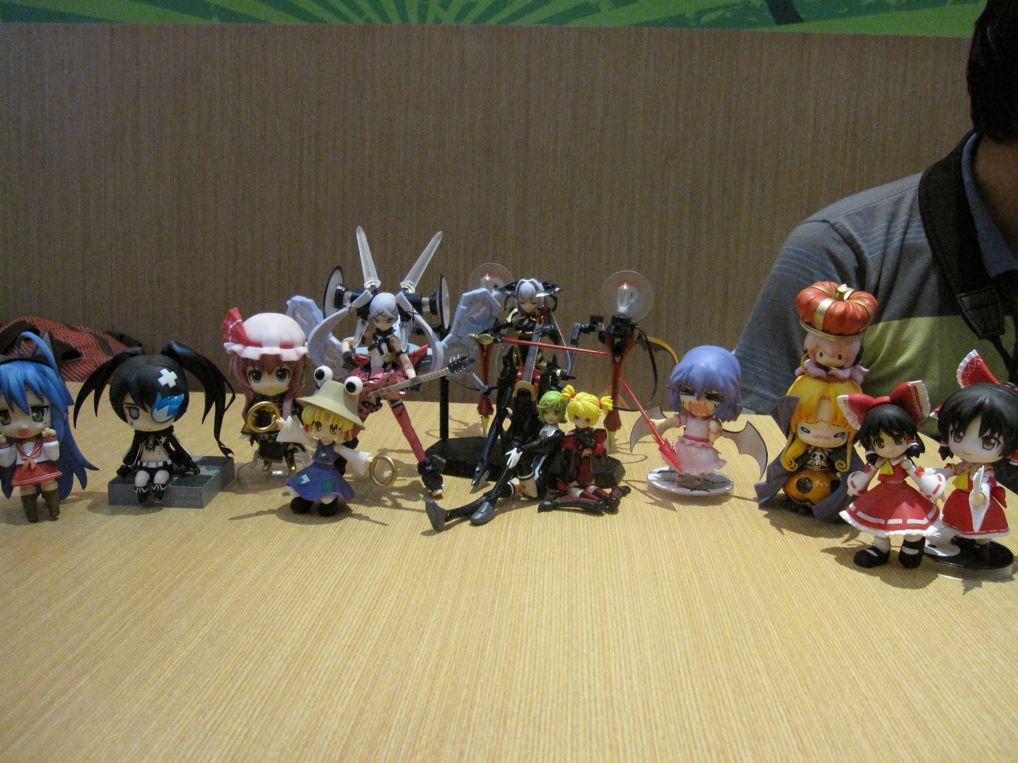 many different items from anime are displayed on a table