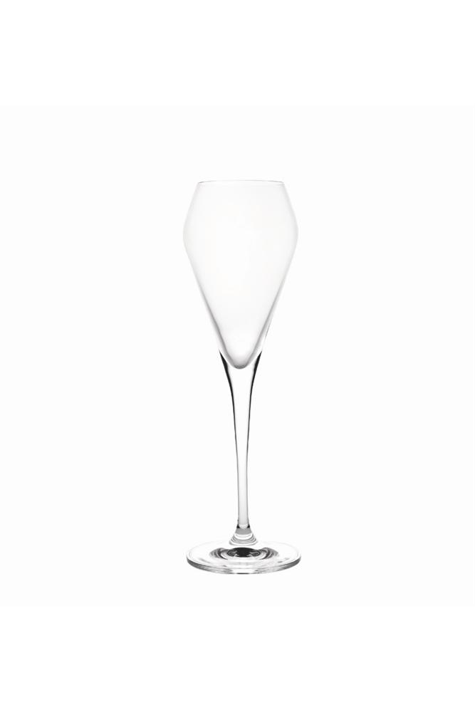 a small empty glass on top of a white surface