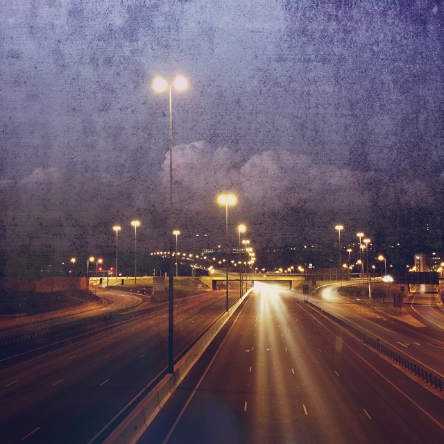 a night time image of city lights and streetlights