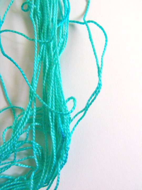 a light blue strand of wax cords