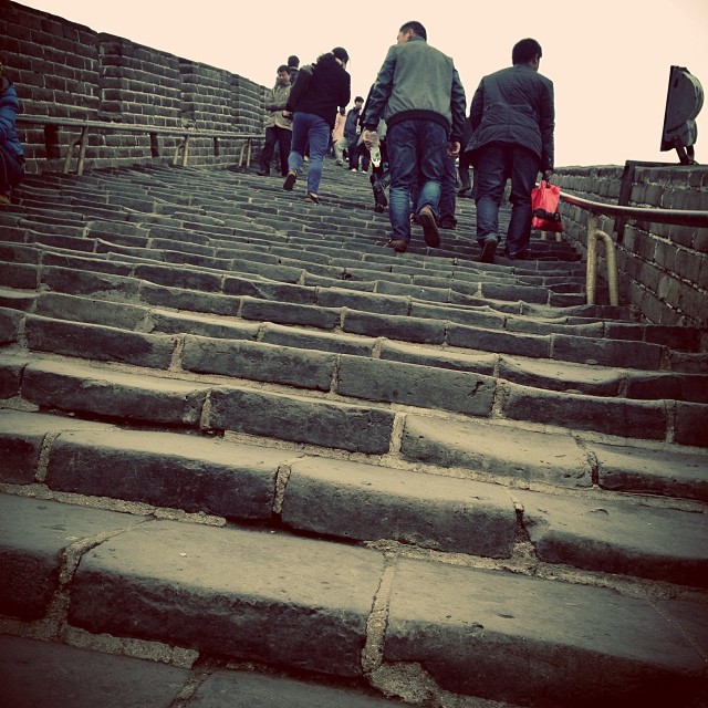 a group of people walking down some steps