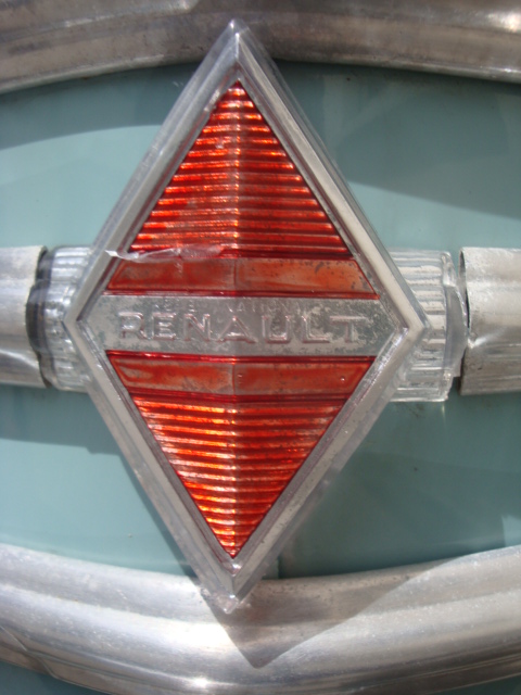 an old fashioned red light emblem with shiny silver pipes