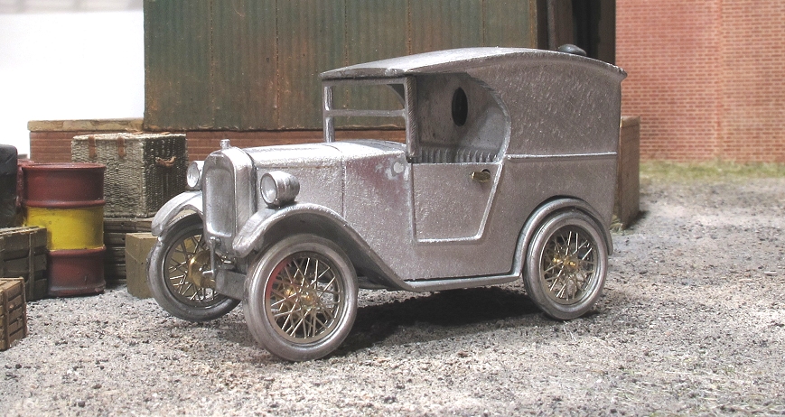 the antique car is being displayed outside on the street