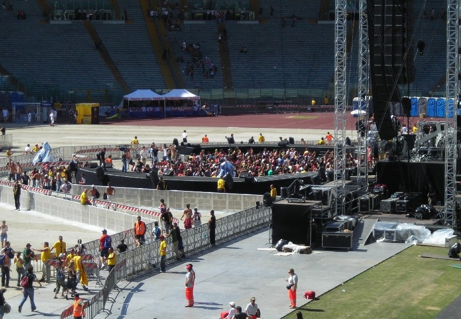 a concert scene as the crowd waits for the show to begin