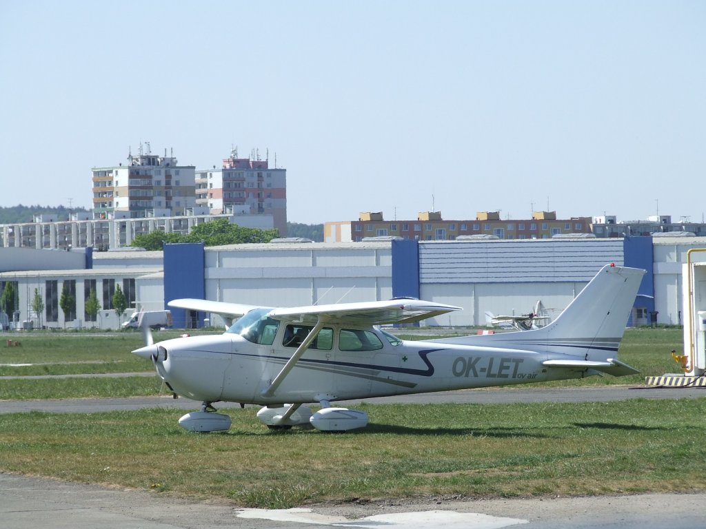 a small airplane sitting on top of an airport runway