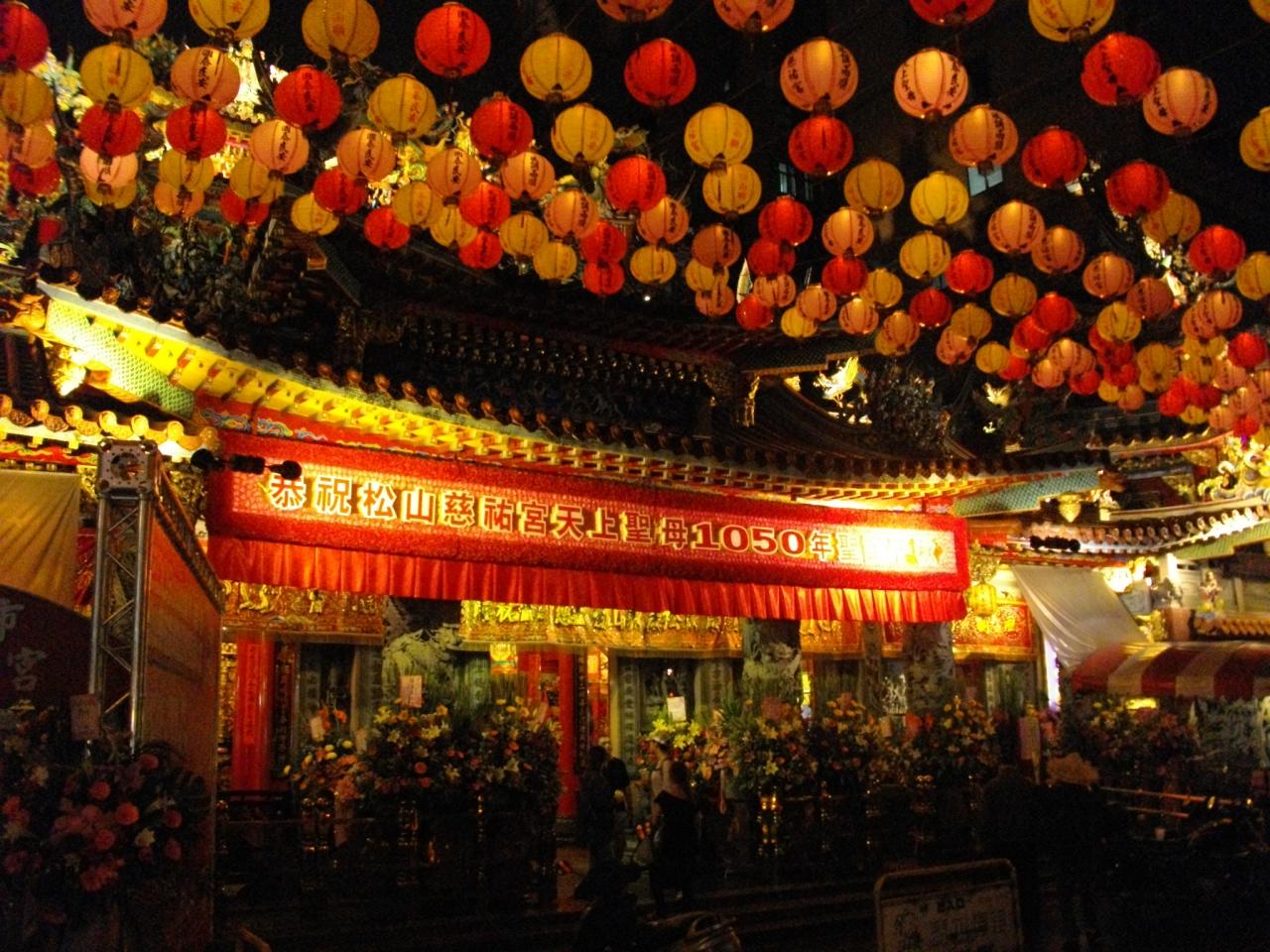 many chinese decorations are hung from the ceiling