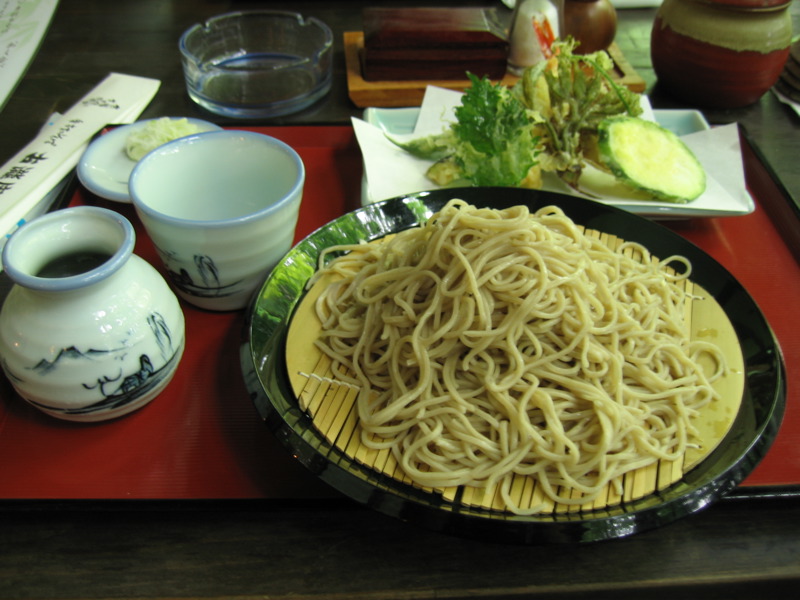 a dish of noodles and soup on a plate
