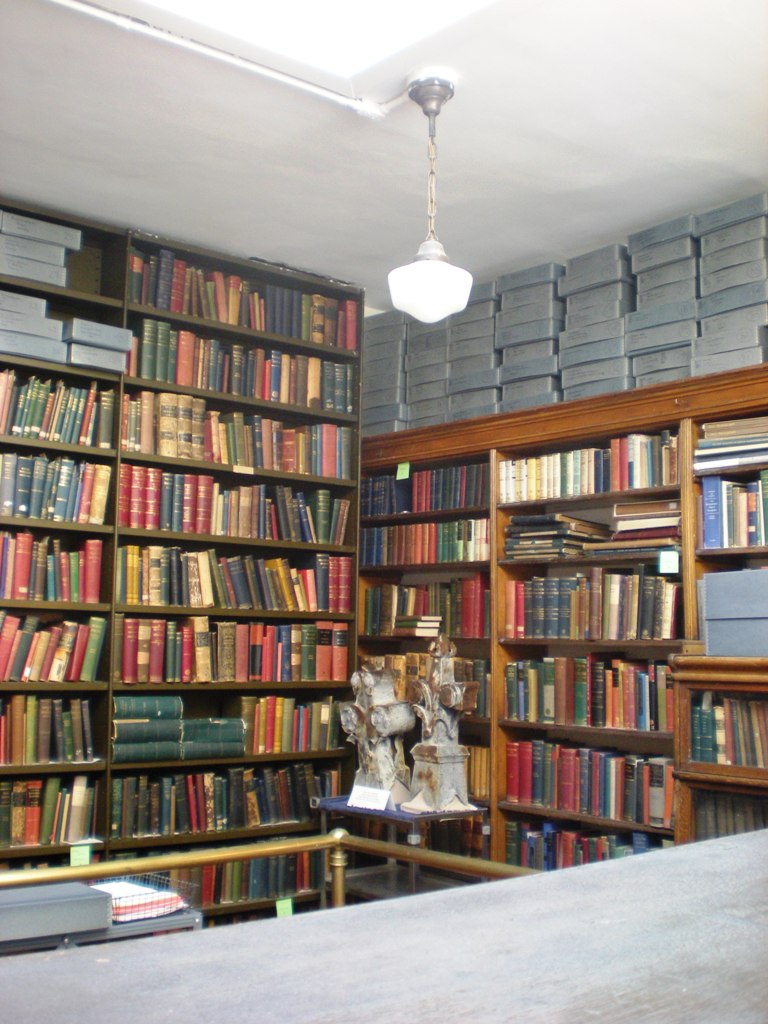 a bookshelf with several rows of books
