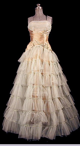 an ivory colored dress on display