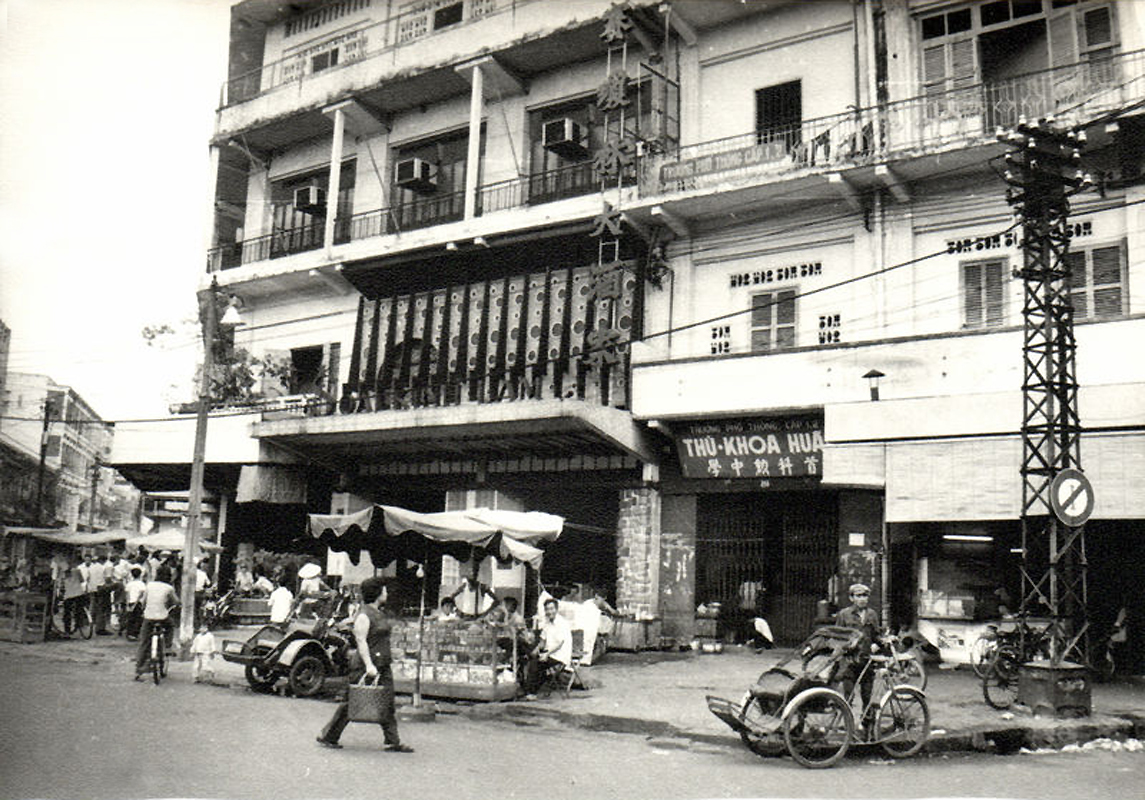 a black and white po of people in the street