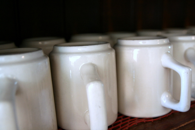 a set of twelve white coffee mugs